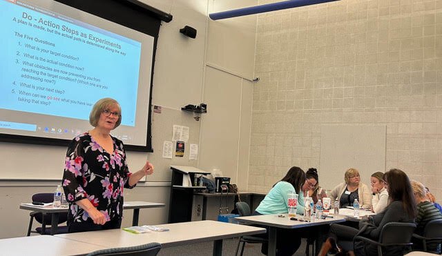 Karen Goike, Michigan Manufacturing Technology Center, explains Lean processes to NCCMH Gaylord staff.