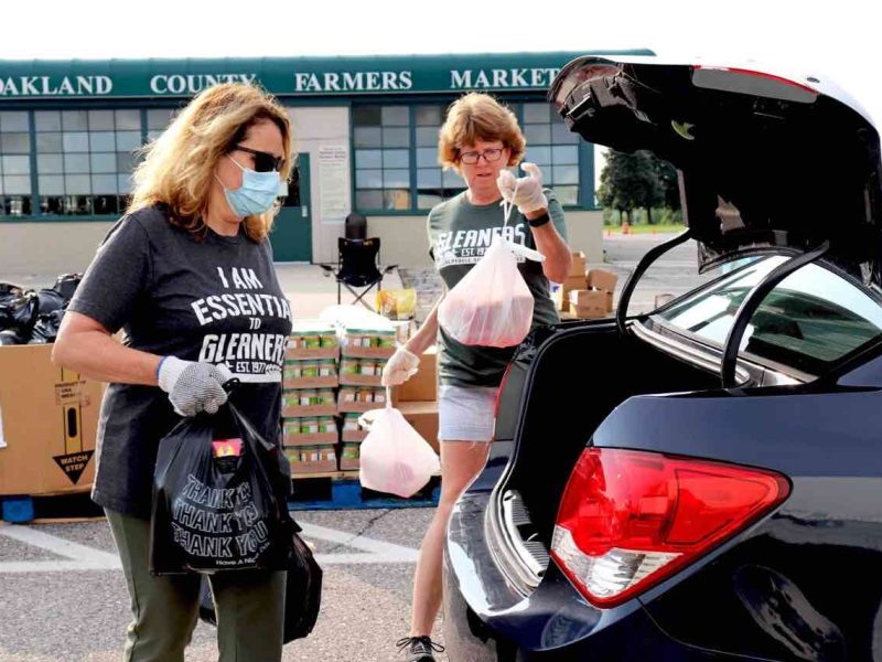 Volunteers for Gleaners Community Food Bank at the Oakland County Farmers Market mobile distribution