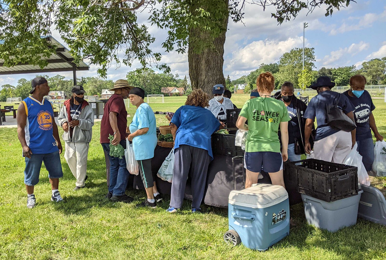 A farm stand at Adams Butzel Complex in Detroit, sponsored by Henry Ford Health, Come Play Detroit, and Eastern Market.