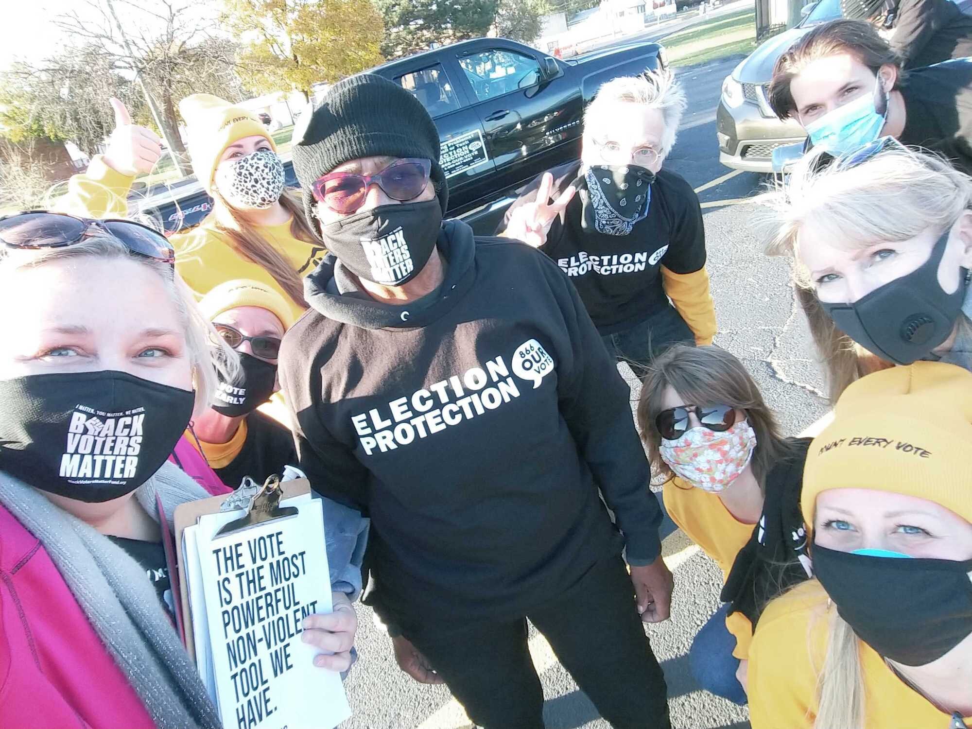 SURJ members collaborate with BLMDetroit help get out the vote.