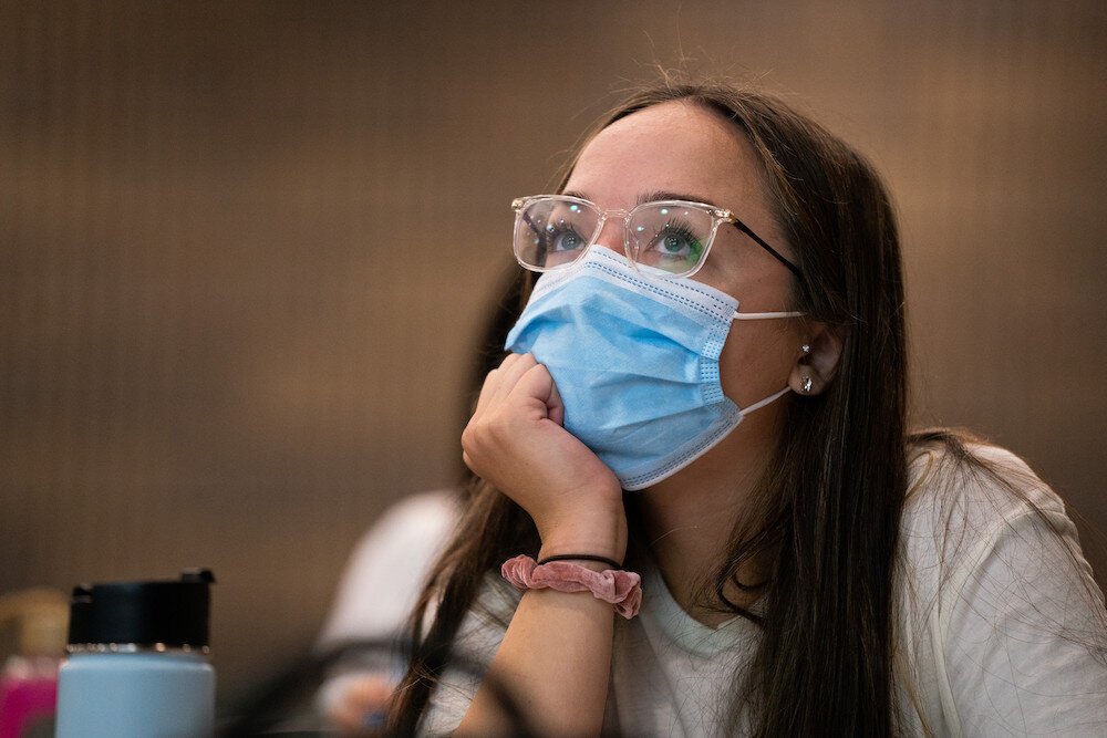 Student wears a mask on campus.