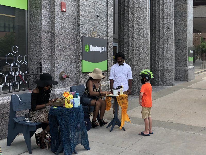 Shiann Howard creates a poem for a young Art Walk attendee.