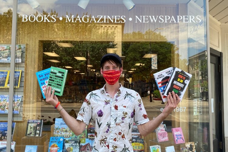 Steven Penkevich in front of Reader's World in downtown Holland.