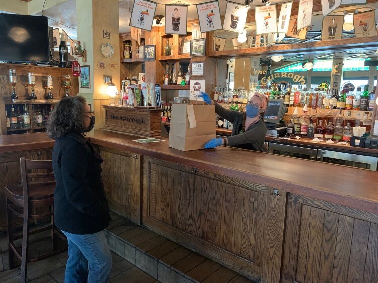 The Curragh Irish Pub switched to takeout during the COVID-19 crisis to maintain social distancing.