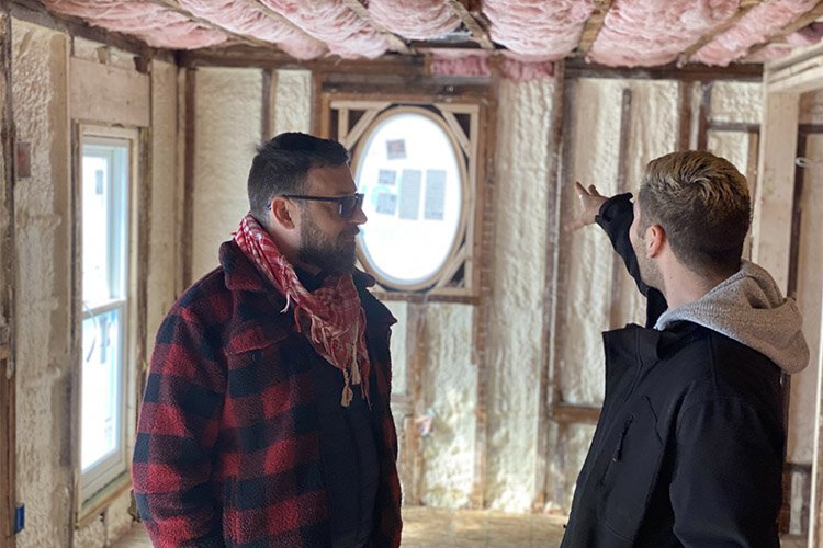Robert Lopez and photographer Chase Lotero stand in a suite in the Lilley Mansion that is being completed.