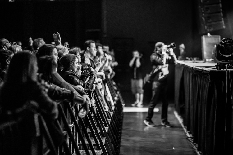 Fans and photographers watch the Rival Sons at the Intersection.