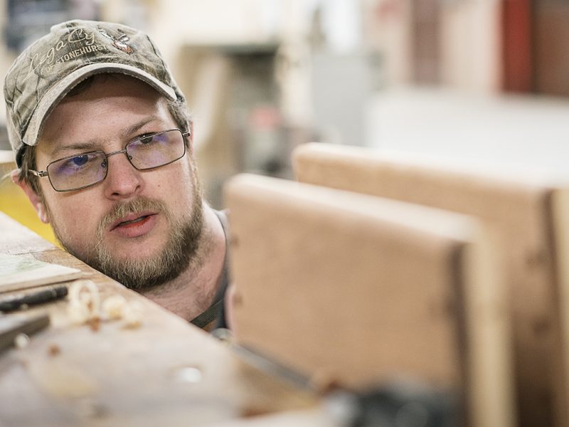 Flint, MI - Friday, February 2, 2018: As he rounds the edges of his project, Flint resident Mike Callahan checks to make sure his progress is even and smooth at Factory Two in Flint.
