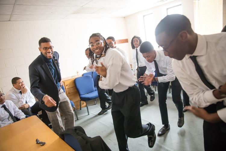 Isaiah Oliver talks through last-minute performance improvements with the Alpha Esquires just prior to the MLK Day Youth Tribute at Mt. Olive Missionary Baptist Church.