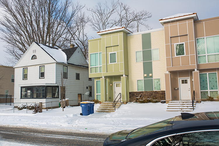 New and old houses put renters and home owners side by side as neighborhoods change with development. 