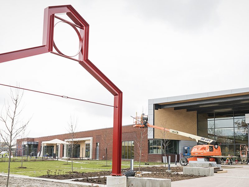 Flint, MI - Tuesday, November 21, 2017: Workers put the finishing touches on the entryway of the new Educare Center in Flint.