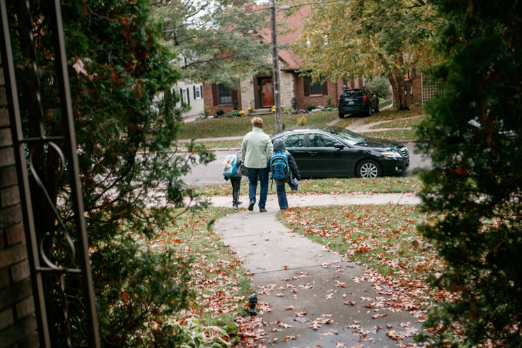 Barbara Lubic walks with her sons Alexander and Harold to classes.