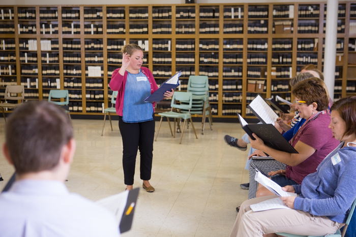 Choir members rehearse away from the sanctuary. 