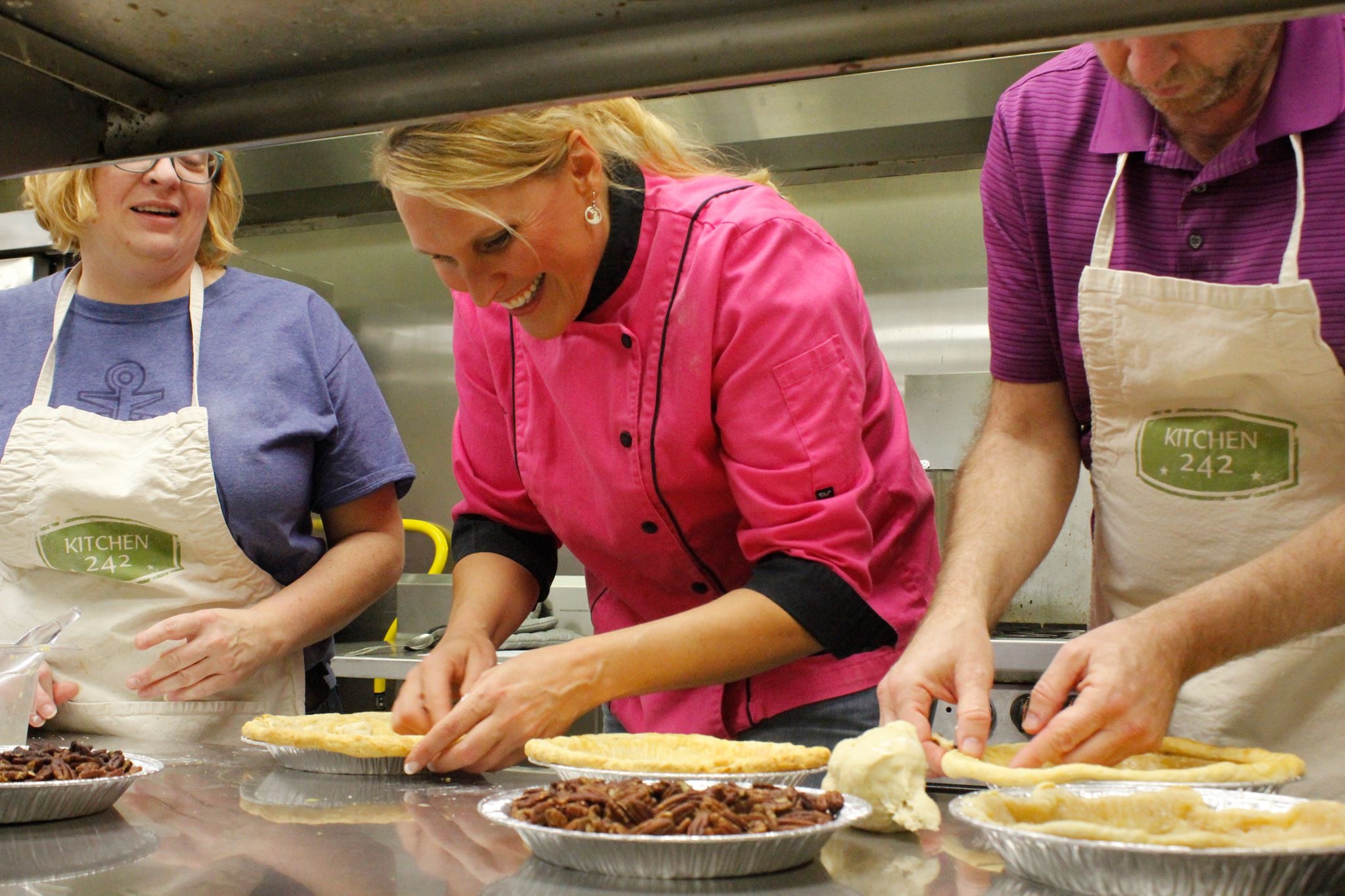 Chef Char Morse, center, teaching a class at Kitchen 242. Photo courtesy of Char Morse.