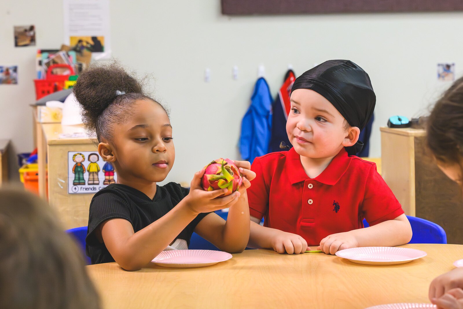 Head Start students at St. John's Universal Church of Christ in Jackson learn about cucumbers and dragonfruit in a lesson on mindful eating.