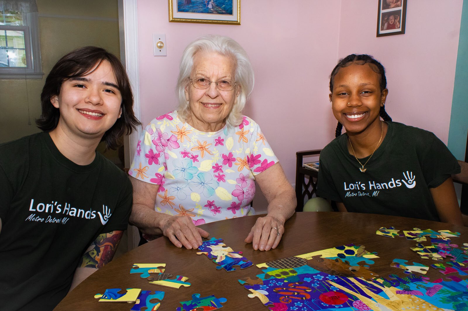 SOCIAL Program volunteers Keen Parra and Antonia Gitau with their client, Janet, at center.
