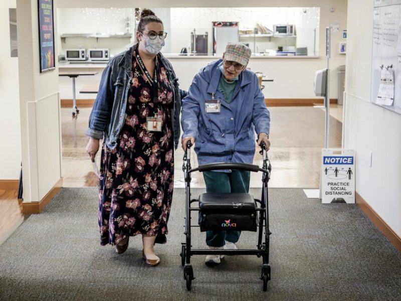 Sarah Milanowski, marketing and communications specialist with LifeCircles PACE, accompanies a PACE participant.