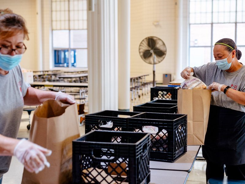 Plymouth-Canton Community Schools staffers prepare meals for pickup.