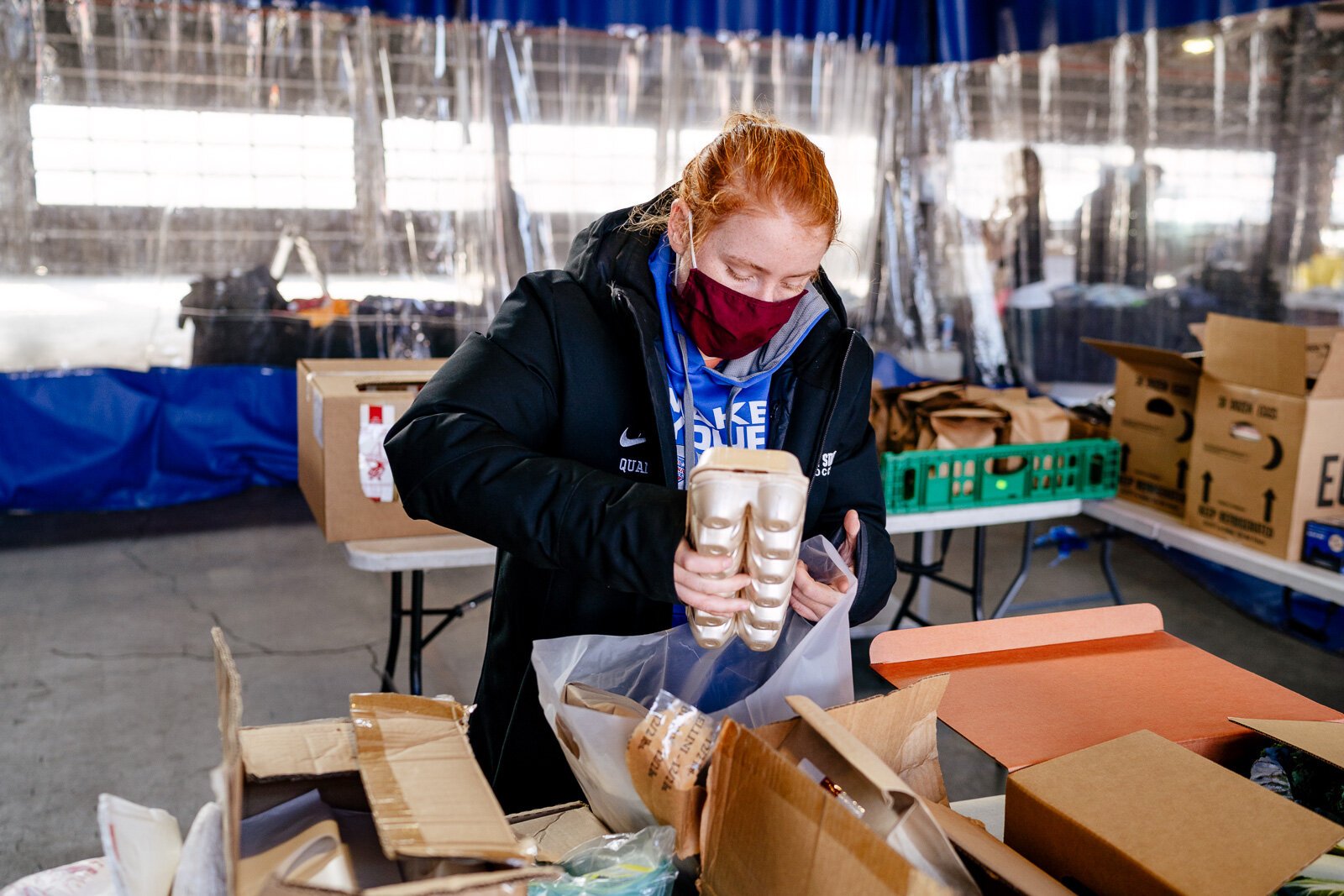 Eastern Market staff prepare food boxes that were ordered online.