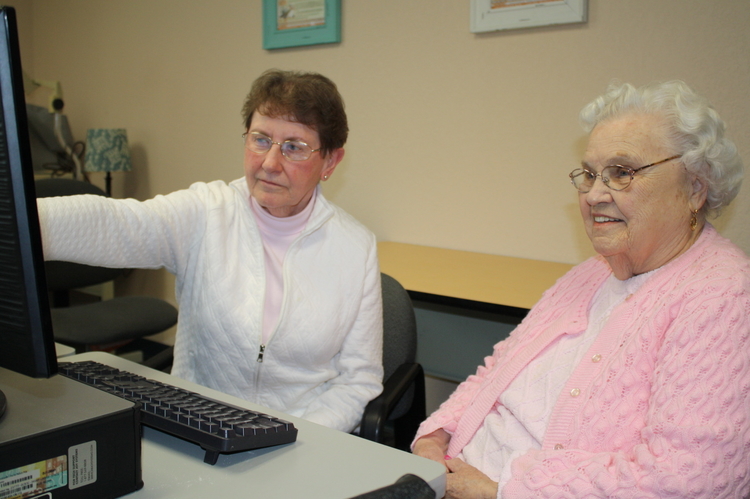 Betty (in pink) connects with her sister in the “old country” using CommunO2 with the help of Mary, a retired senior volunteer in Otsego County. Betty had not seen her sister in about 15 years.