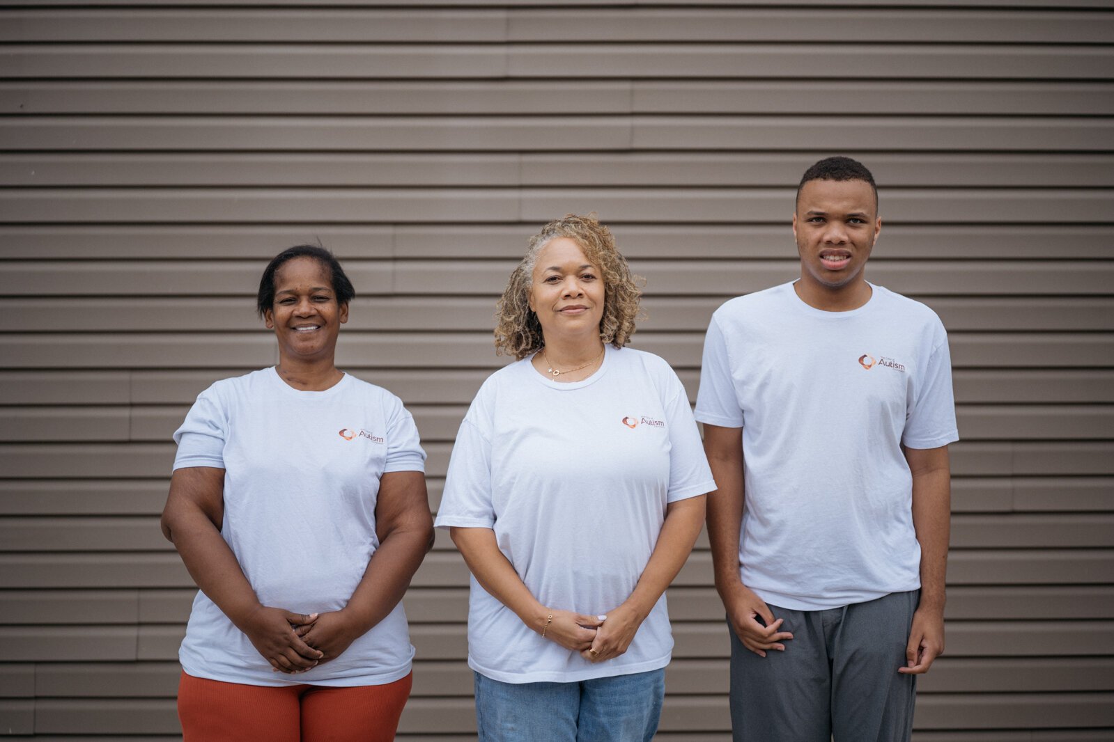Color of Autism Foundation parent advocate Tanisha Burton, Color of Autism Foundation Executive Director Camille Proctor, and Proctor's son Ari Proctor.