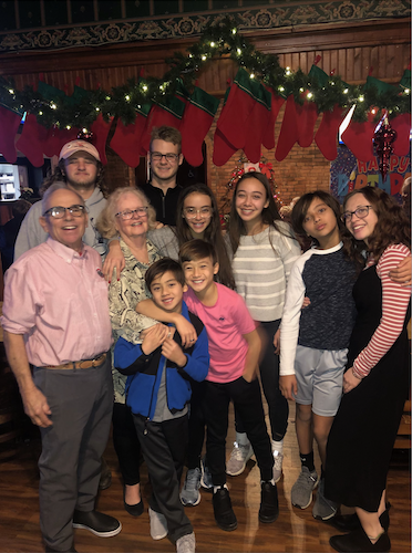 Jimm and Judy Corso pose with their grandchildren at Jimm's 75th birthday party in 2019.