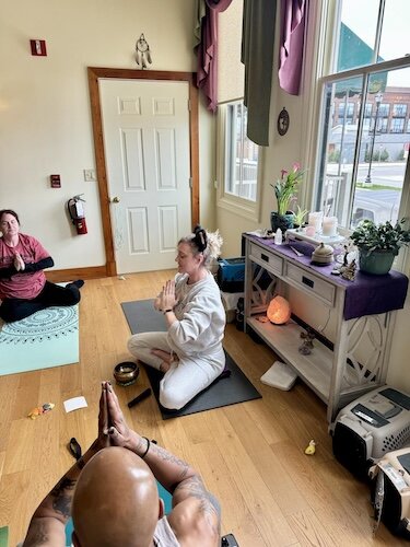 Jamie Bishop leads a kitten yoga session at True Nature Wellness in Sandusky.