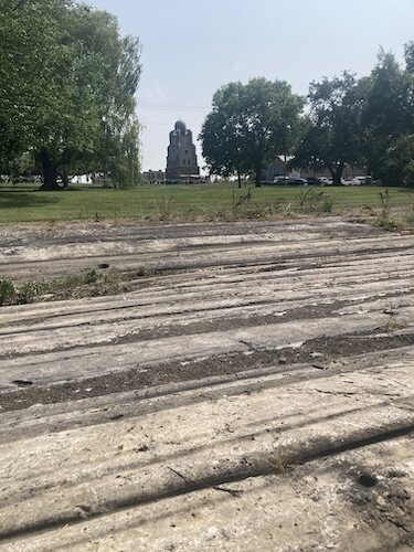 The iconic tower of Lonz Winery is seen in the distance from the glacial grooves, which are also located at Middle Bass Island State Park. 