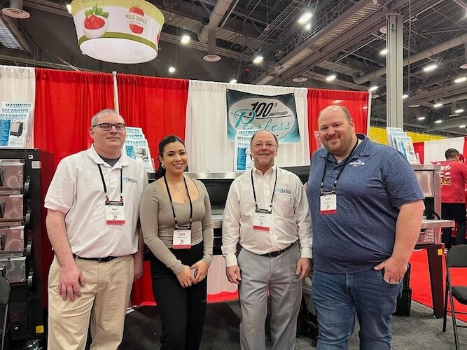 The Peerless Ovens team poses for a photo at the 2024 International Pizza Expo & Convention.