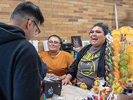 Martha Cano and her daughter, Luz, laugh with a customer at La Latinoamericana. (Photo/Jordan Sternberg)