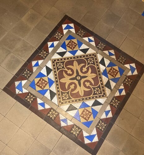 The mosaic tile floor is still intact at the entrance to what was the sheriff's residence area. (Photo/Kristina Smith)
