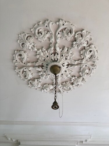 Original decorative molding and plastwork is still intact inside Cooke Castle, which was built in 1864 and 1865.