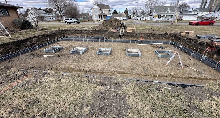 Foundation for a new Habitat home is installed on West Broad Street in Monroeville.