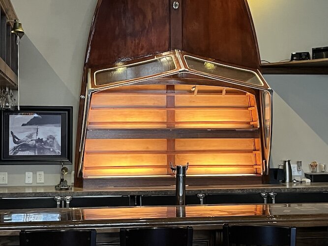 Part of a Lyman is a visual feature behind the bar of The Dinky Pub.