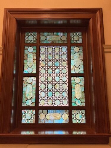 An art glass window designed by Jessie May Livermore.