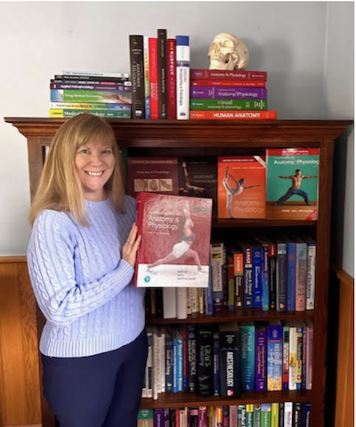 Nath holds the 12th edition of Fundamentals of Anatomy & Physiology, which officially will launch this month. (Photo/Courtesy of Judi Nath)