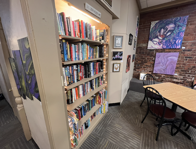 Guests are welcome to read a book from the coffee house library while they enjoy their beverages.