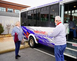 Dick Ries greets a tour member at the Jackson Street Pier. (Photo/Kevin Lee)