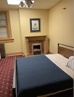 Guests can cozy up in one of the property's bedrooms. (Photo courtesy of Michael Cox)