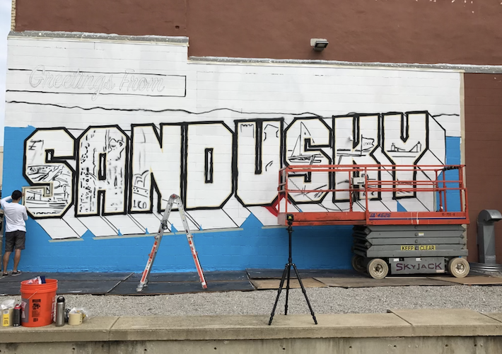 The Greetings Tour painted the first mural in 2018.