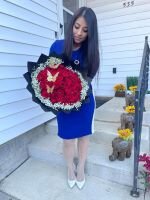 Meza displays a floral arrangement.