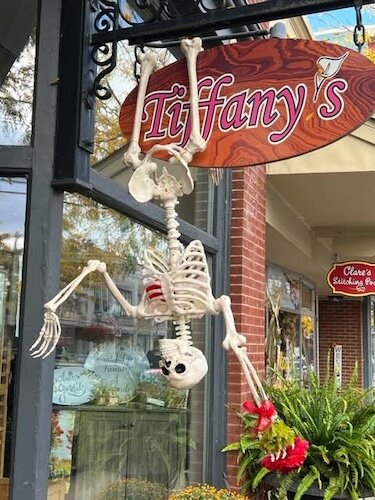 This skeleton is head over heels at Tiffany's Flowers.