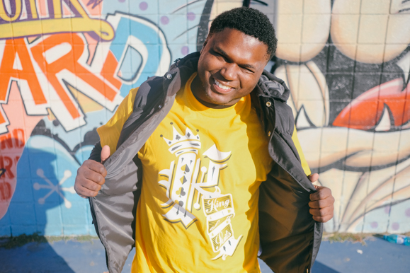 Xavier Franklin, founder of Kencade Apparel, shows off one of his designs at the Lester Community Center. (Brandon Dahlberg)