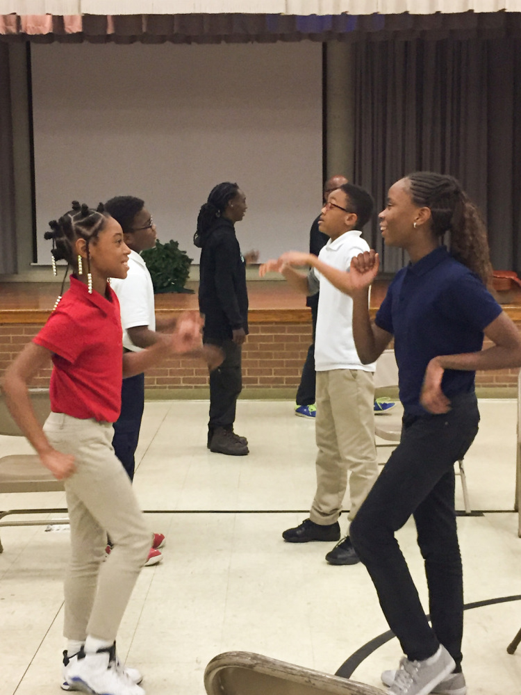 Geniece and her partner Khrystal, both 10, communicate through movement as part of a Playback Memphis exercise. (Cole Bradley)