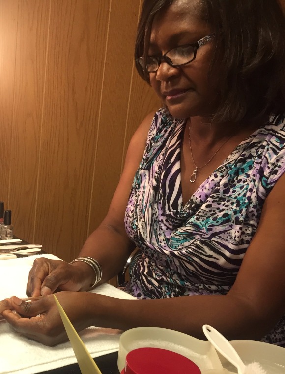 Janice Penny, owner of Colours the Nail Salon, does a patron's nails. (Sarah Jones)
