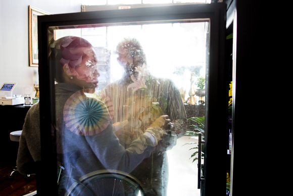 Colby Midgett assists a customer at her Downtown flower shop. (Renier Otto)