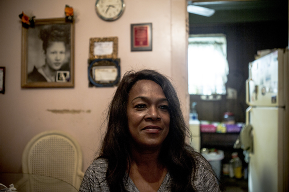 Deidra Tuggle, the Candy Lady of Orange Mound, serves up a nacho plate in her kitchen for her after school customers.