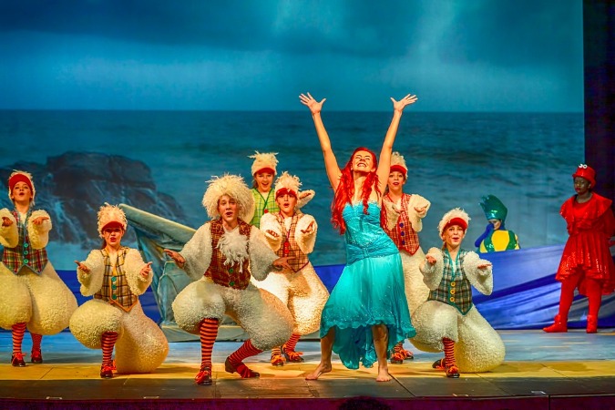 Madison Alexander as Ariel and her flock of seagulls perform during New Day Children's Theatre's production of "The Little Mermaid".