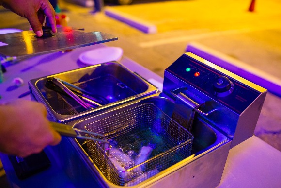 Rico Fields serves up a soul roll order using a portable fryer.