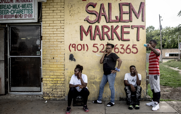 Folks hang out outside of Salem's Market on Mississippi Avenue. The store has been open for decades in the neighborhood and has seen a significant slowing of business since Foote Homes closed and demolition started.