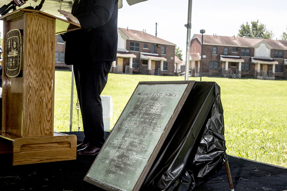 A plaque bearing the history of the Foote Homes housing complex is presented during a ceremony announcing its demolition in May.